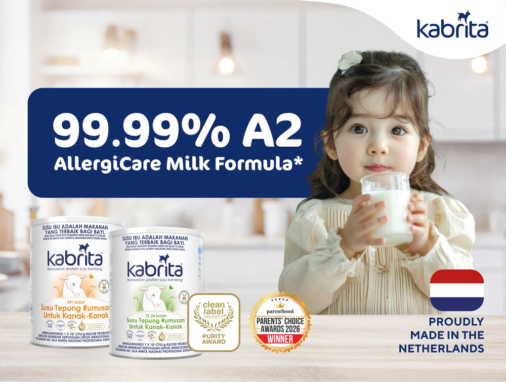 Kabrita A2 milk banner showing a child with a cup, product tins and an A2 percentage claim.Sepanduk susu A2 Kabrita yang menunjukkan kanak-kanak dengan cawan, tin produk dan dakwaan peratusan A2.