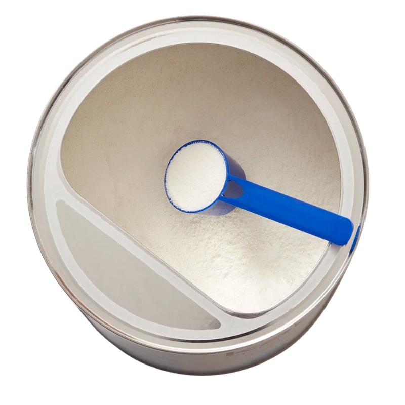 Open milk powder tin with a measuring scoop on a marble surface.Tin serbuk susu terbuka dengan sudu penyukat di atas permukaan marmar.